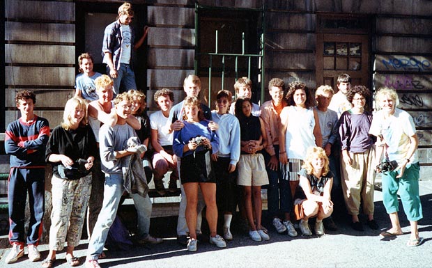 A group of passengers standing outside a building in New York