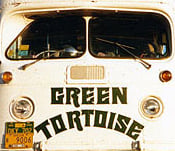 The front of a Green Tortoise bus, standing for the company